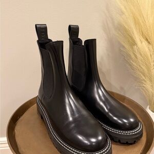 STAUD Glossy Black Leather Boots